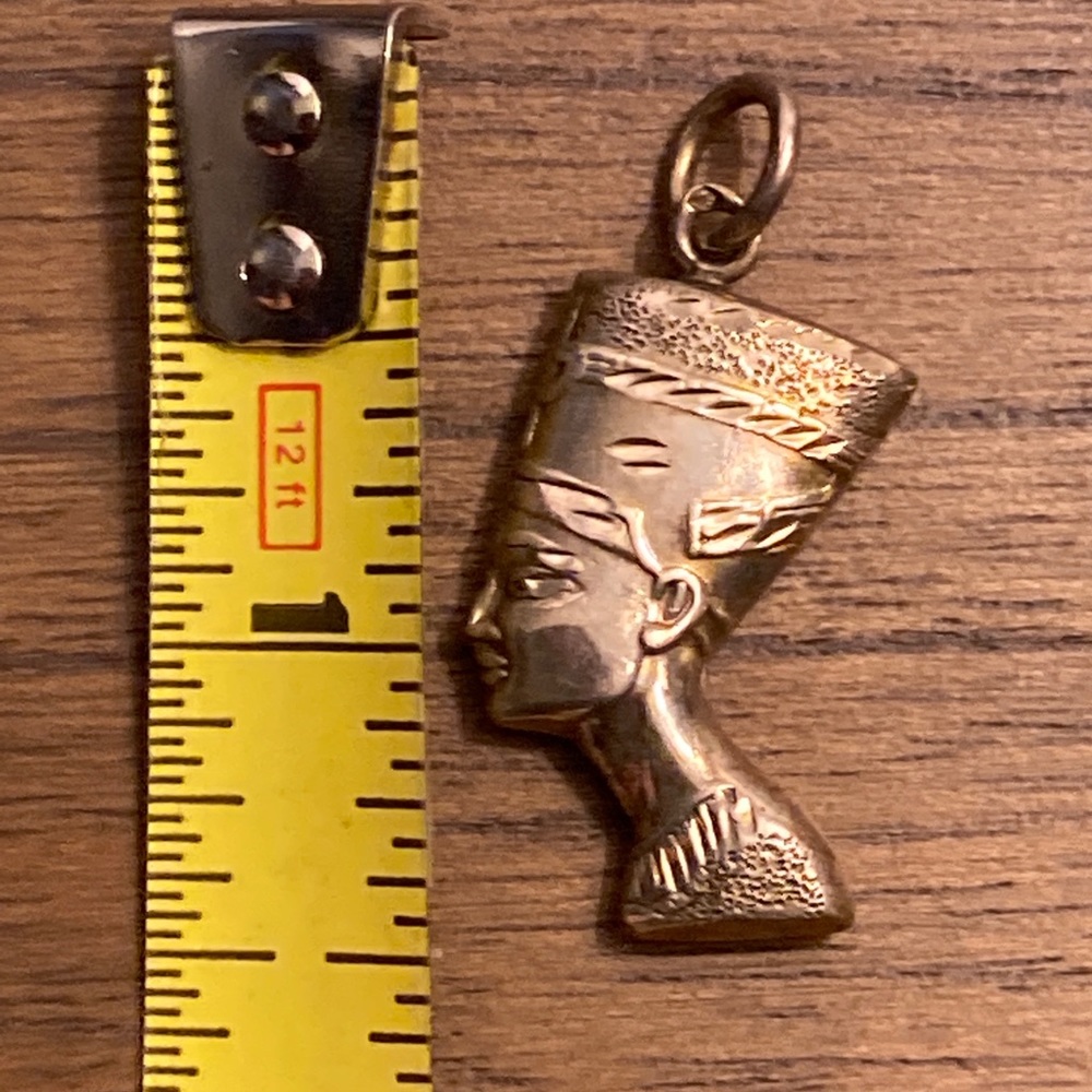 Three Egyptian silver pendants